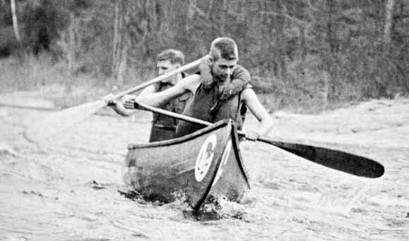 Photo of Carl in the bow of a canoe