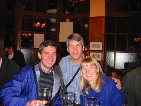 Photo, three people at a bar