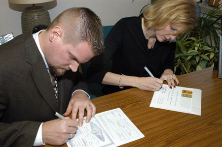 051230-4567_Signing