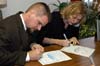 051230-4562_Signing
