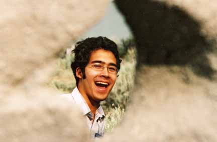 photo of student looking through erosion hole