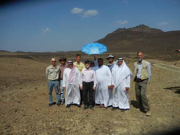 Photo of Mark and other field workers in the hot sun