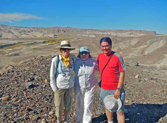 Thumbnail of and link to larger photo of three geologists in the field