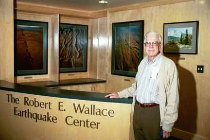 Bob Wallace in front of foyer sign