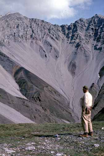 photo, Bill viewing the sub-Mississippian unconformity on a steep mountainside in the distance